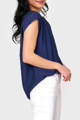 Side view of Woman modeling Cap Sleeve Notch Neck Blouse in Navy blue styled business casual