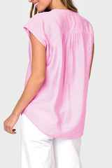 Back view of Woman modeling Cap Sleeve Notch Neck Blouse in Lilac pink styled with casual pants