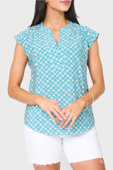 Woman modeling Cap Sleeve Notch Neck Blouse in teal leaf tile green print styled for weekends and work