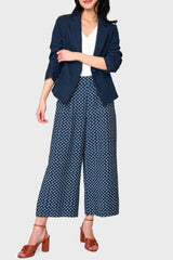 Woman modeling Wide Hem Cropped Linen Pant in Navy Daisy print styled with tee and jacket