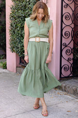 @themotherchic Woman modeling Lindsey Utility Maxi Dress in Vineyard Green styled with belt and sandals