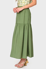 Side view of Woman modeling Playa Tiered Maxi Skirt in Vineyard Green styled with sandals
