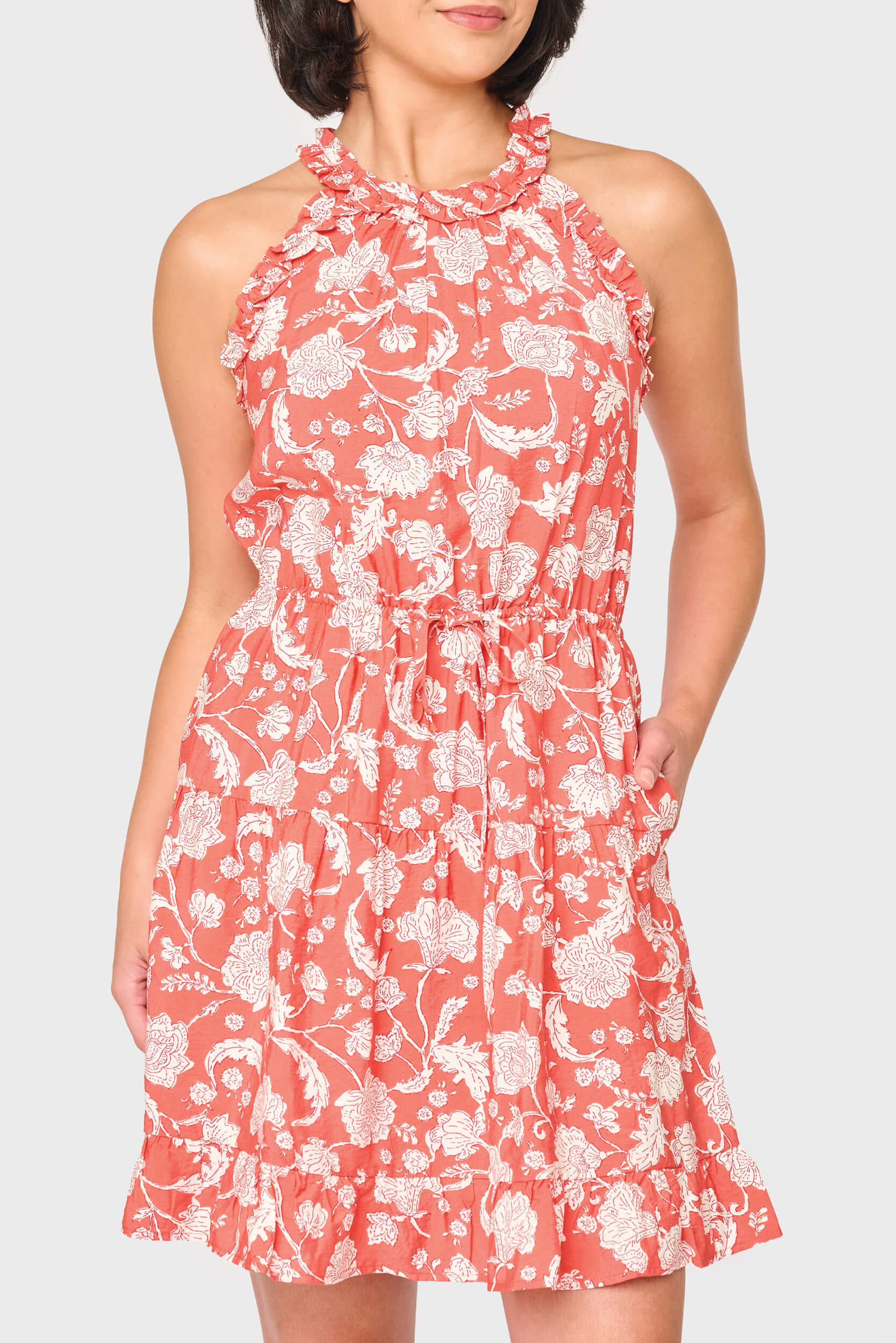 Woman modeling Khloe Ruffle Halter Dress in Desert Rose Garden print styled for nights out and vacations