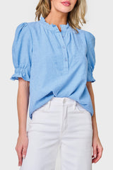 Model wearing Dianthus Henley Puff Sleeve Blouse in textured Blue Skies, styled business casual