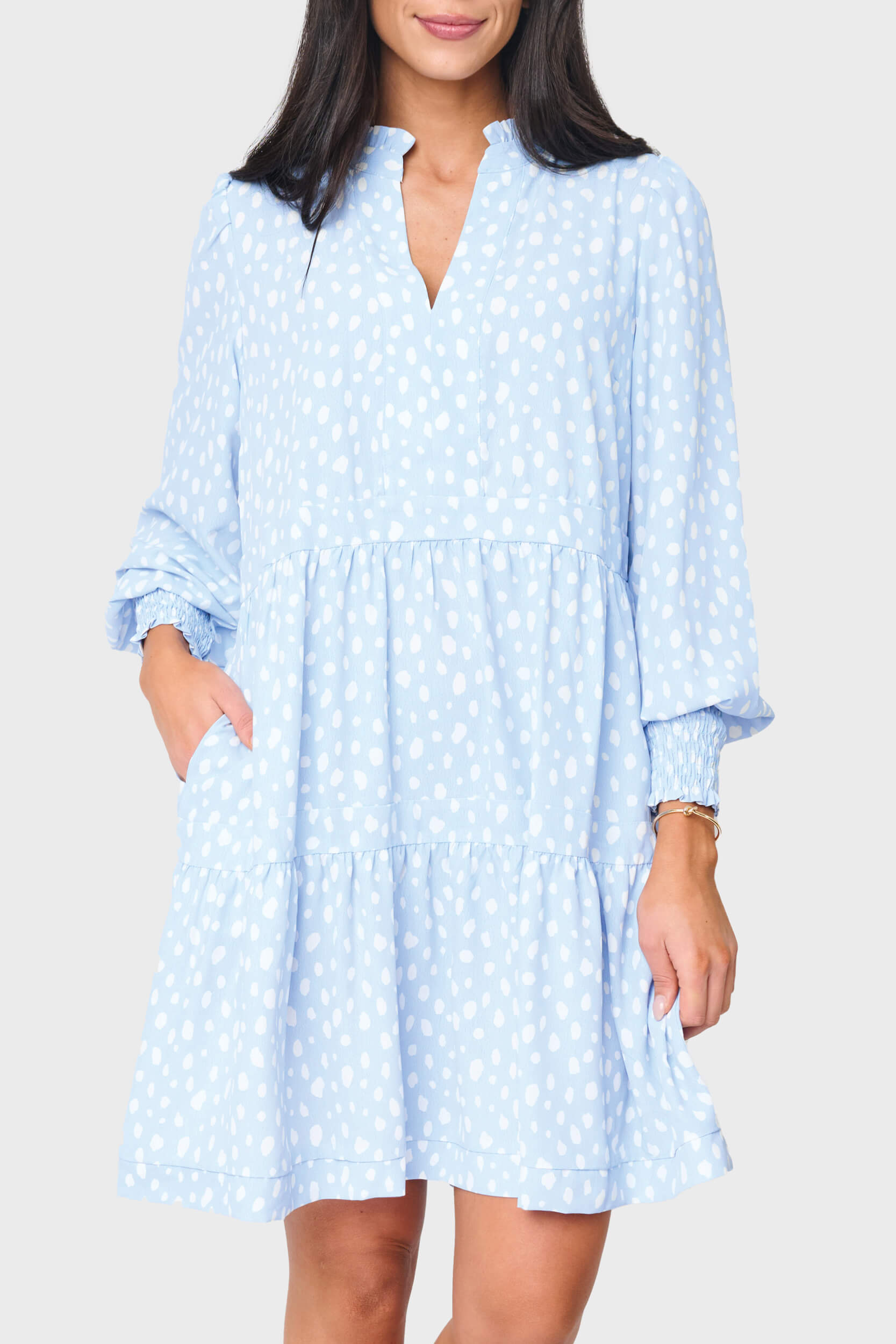 Woman modeling Long Sleeve Decked Out Day Dress in light blue animal print dot styled for work and parties