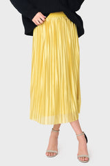 Woman modeling Erin Shine Pleated Midi Skirt in Gold styled for holiday events