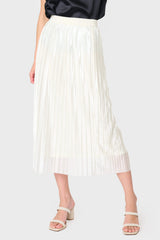 Woman modeling Erin Shine Pleated Midi Skirt in Ivory styled for holiday parties