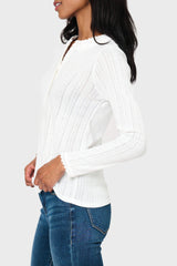 Side of Woman modeling Ava Crochet Trim Pointelle Henley Top in White styled everyday casual