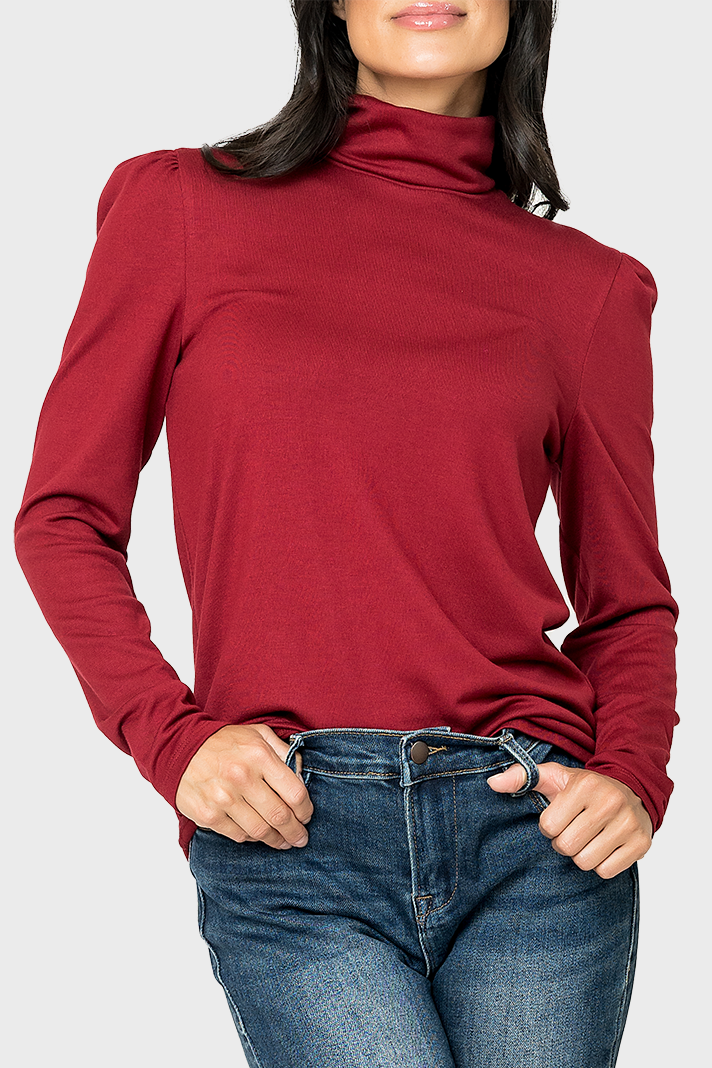 women wearing a deep garnet red lightweight long sleeve turtleneck top