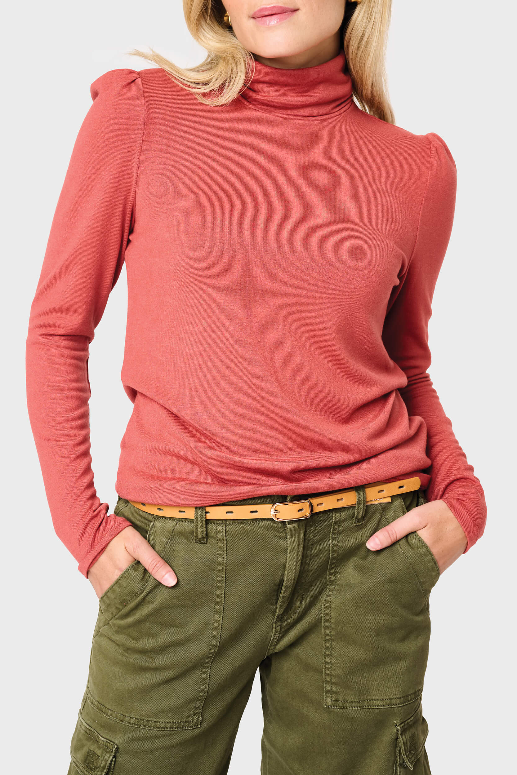 Woman modeling Essential Turtleneck Soft Sweater Knit Top With Puff Sleeve in Burnt Sienna orange styled everyday casual
