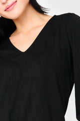 Detail of Woman modeling V-Neck Blouson Sleeve Sweater Top in Black styled everyday casual