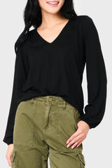 Woman modeling V-Neck Blouson Sleeve Sweater Top in Black styled everyday casual