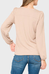 Back Woman modeling V-Neck Blouson Sleeve Sweater in Taupe tan, styled business casual for work