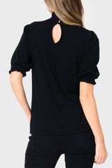 Keyhole Back of Woman modeling Feminine Mock Neck Luxe Sweater Top in Black styled business casual