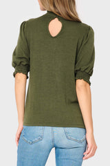 Keyhole back of Woman modeling Feminine Mock Neck Luxe Sweater Top in olive green styled business casual for work