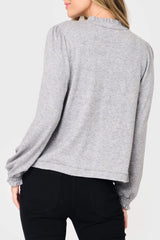 Back of Woman modeling Feminine Mock Neck Luxe Cardigan in Heather Grey styled business casual for work