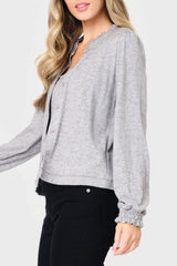Side of Woman modeling Feminine Mock Neck Luxe Cardigan in Heather Grey styled business casual for work