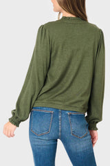 Back of Woman modeling Feminine Mock Neck Luxe Cardigan in Olive Green styled for business casual work