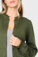 Detail of ruffle trimmed olive green knit cardigan sweater