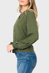 Side of Woman modeling Feminine Mock Neck Luxe Cardigan in Olive Green styled for business casual work