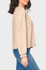 Side of woman modeling Feminine Mock Neck Luxe Cardigan in Oatmeal beige styled business casual