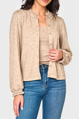 woman modeling Feminine Mock Neck Luxe Cardigan in Oatmeal beige styled as a set for work