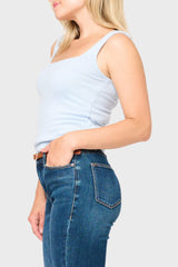 Woman modeling Feminine Luxe Sweater Tank in Cashmere light blue styled to be worn under a blazer