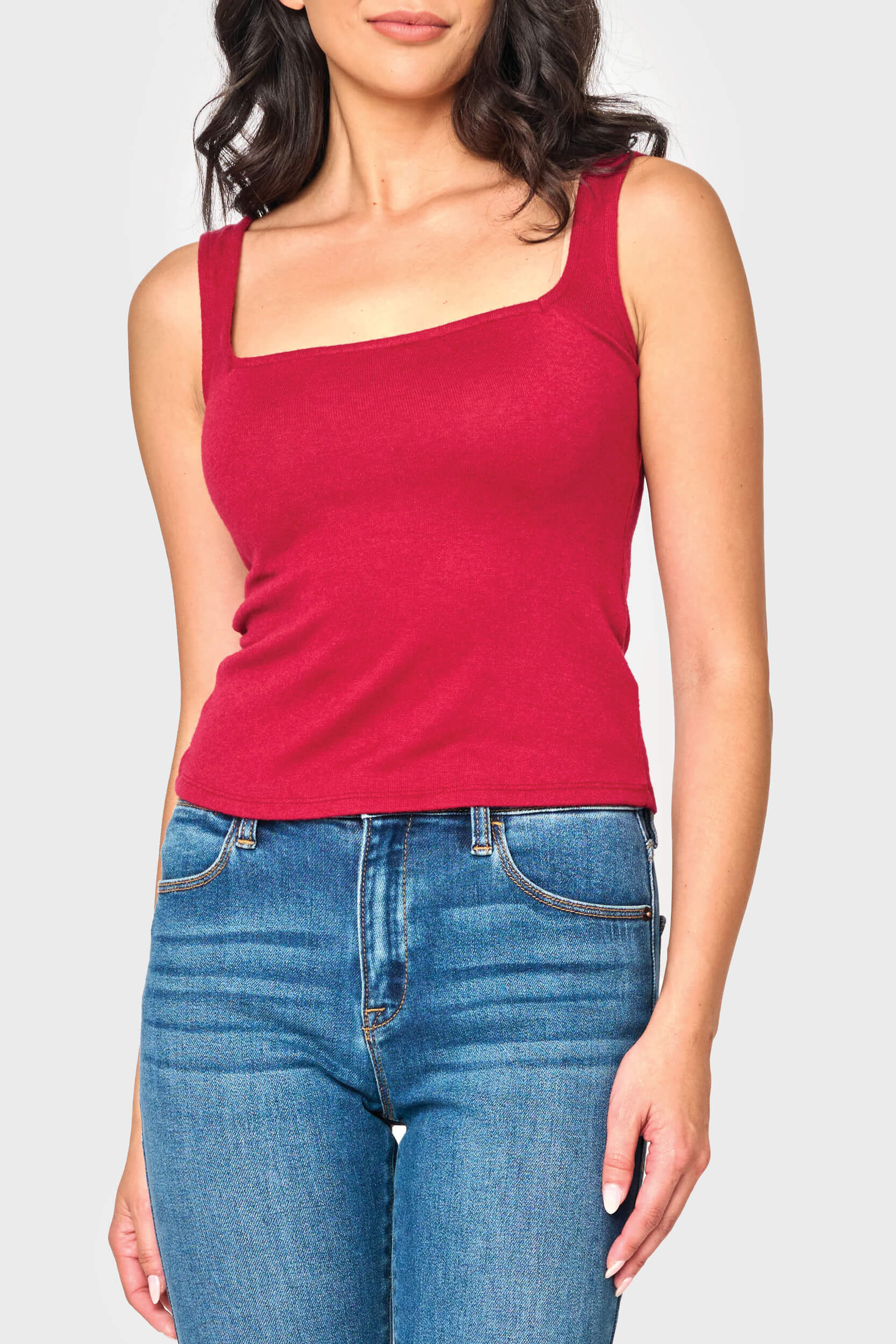 Woman modeling Feminine Luxe Sweater Tank in Cranberry red styled casual for everyday