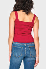 Back of Woman modeling Feminine Luxe Sweater Tank in Cranberry red styled casual for everyday