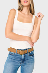 Woman modeling Feminine Luxe Sweater Tank in Ivory white styled to be layered under a jacket