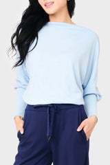 woman modeling Slouchy Luxe Open Neck Sweater in Cashmere blue styled everyday casual weekend cozy