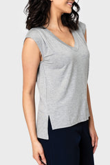 Side of Woman modeling The Favorite Luxe Essentials V-neck Tee in Heather Grey featuring split hem