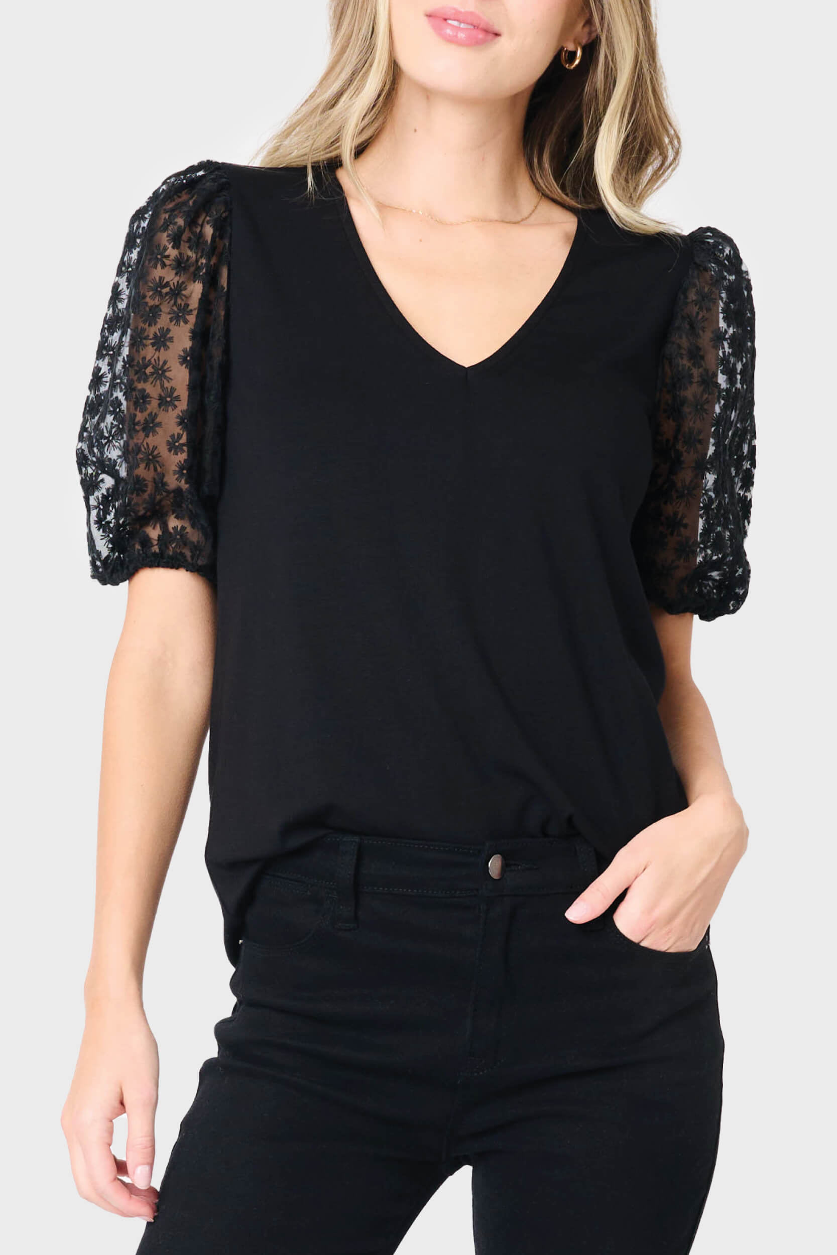 Woman modeling Megan Mixed Media Soft Ponte Top in Black styled for work, date nights, and parties