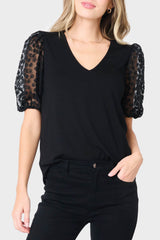 Woman modeling Megan Mixed Media Soft Ponte Top in Black styled for work, date nights, and parties