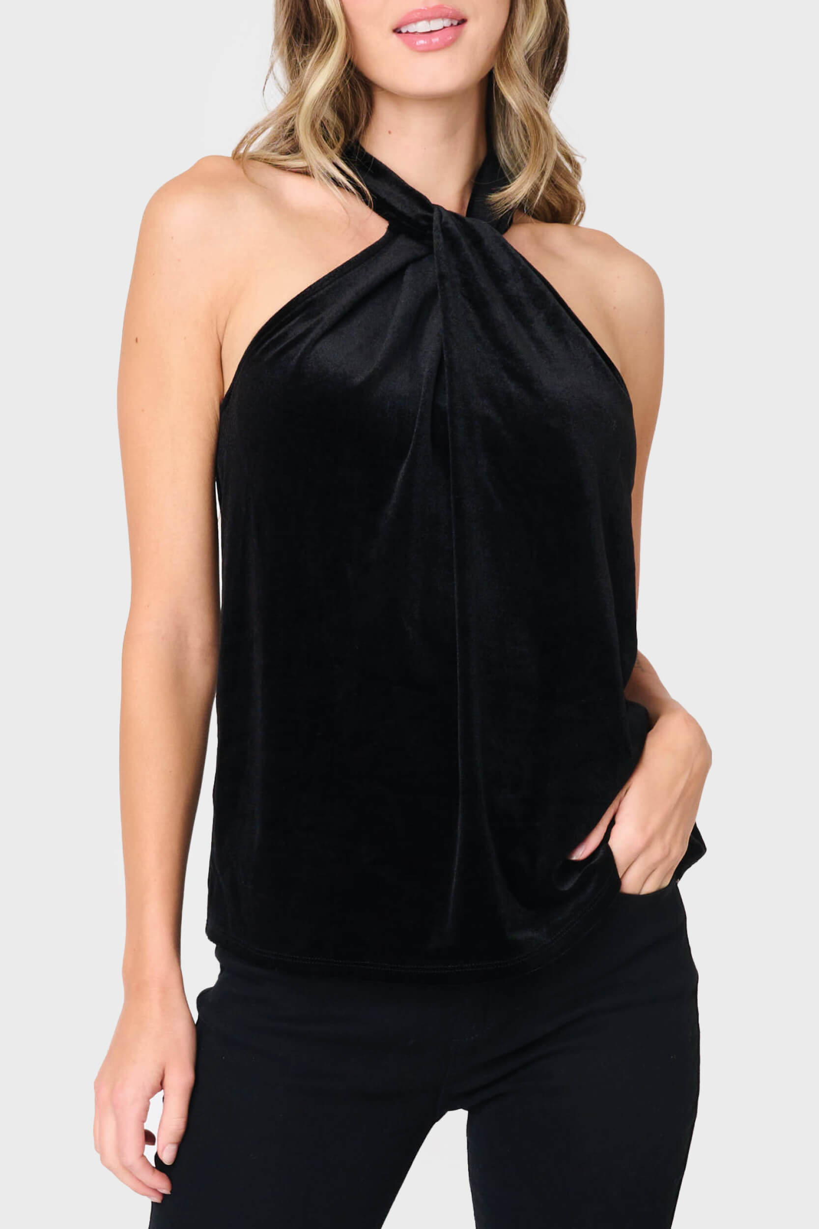 Woman modeling Twist Neck Velvet Halter in Black styled for holiday parties and date nights