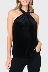 Woman modeling Twist Neck Velvet Halter in Black styled for holiday parties and date nights