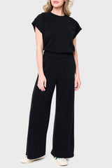 Full body Woman modeling Soft Cloud Scuba Luxe Everywhere Top in black, styled with the matching pants
