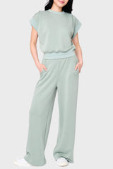 Woman modeling Soft Cloud Scuba Luxe Everywhere Pant in sage green, styled with matching top and sneakers