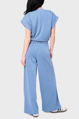 Back view Woman modeling Soft Cloud Scuba Luxe Everywhere Top in denim blue, styled with the matching pants