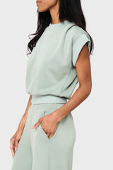 Side view Woman modeling Soft Cloud Scuba Luxe Everywhere Top in sage green, styled with the matching pants