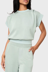 Woman modeling Soft Cloud Scuba Luxe Everywhere Top in sage green, styled with the matching pants