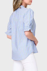 Back view of Model wearing Dianthus Henley Puff Sleeve Striped Blouse in Blue White stripe styled for summer