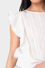 Close-up of women wearing Elan Ruffle Sleeve Detail Smocked Blouse in white