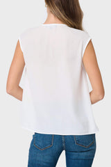 Back view of Woman modeling The Favorite V-Neck Blouse in Ivory styled with denim pants
