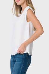 Side view Woman modeling The Favorite V-Neck Blouse in Ivory styled with denim pants