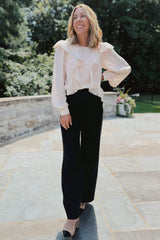 @themotherchic wearing Ophelia Ruffle Boho Blouse in light pink styled business casual