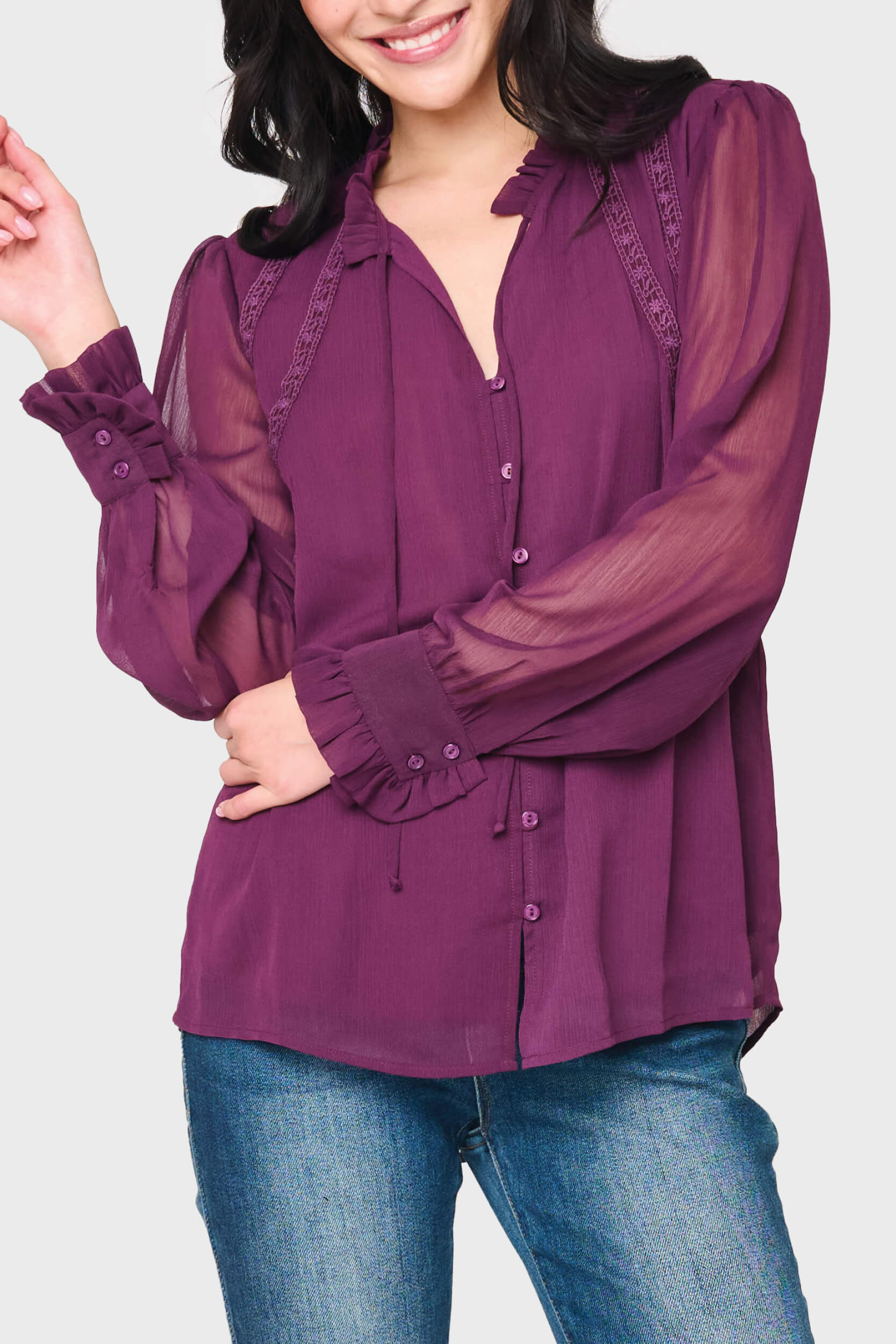 Woman modeling Long Sleeve Crochet Trim Blouse in Deep Plum purple styled business casual