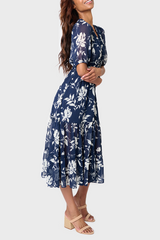 Side of Woman modeling Kira Drawstring Midi Dress in Navy White Floral styled for work and weekends