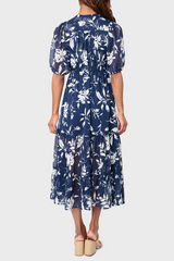 Back of Woman modeling Kira Drawstring Midi Dress in Navy White Floral styled for work and weekends