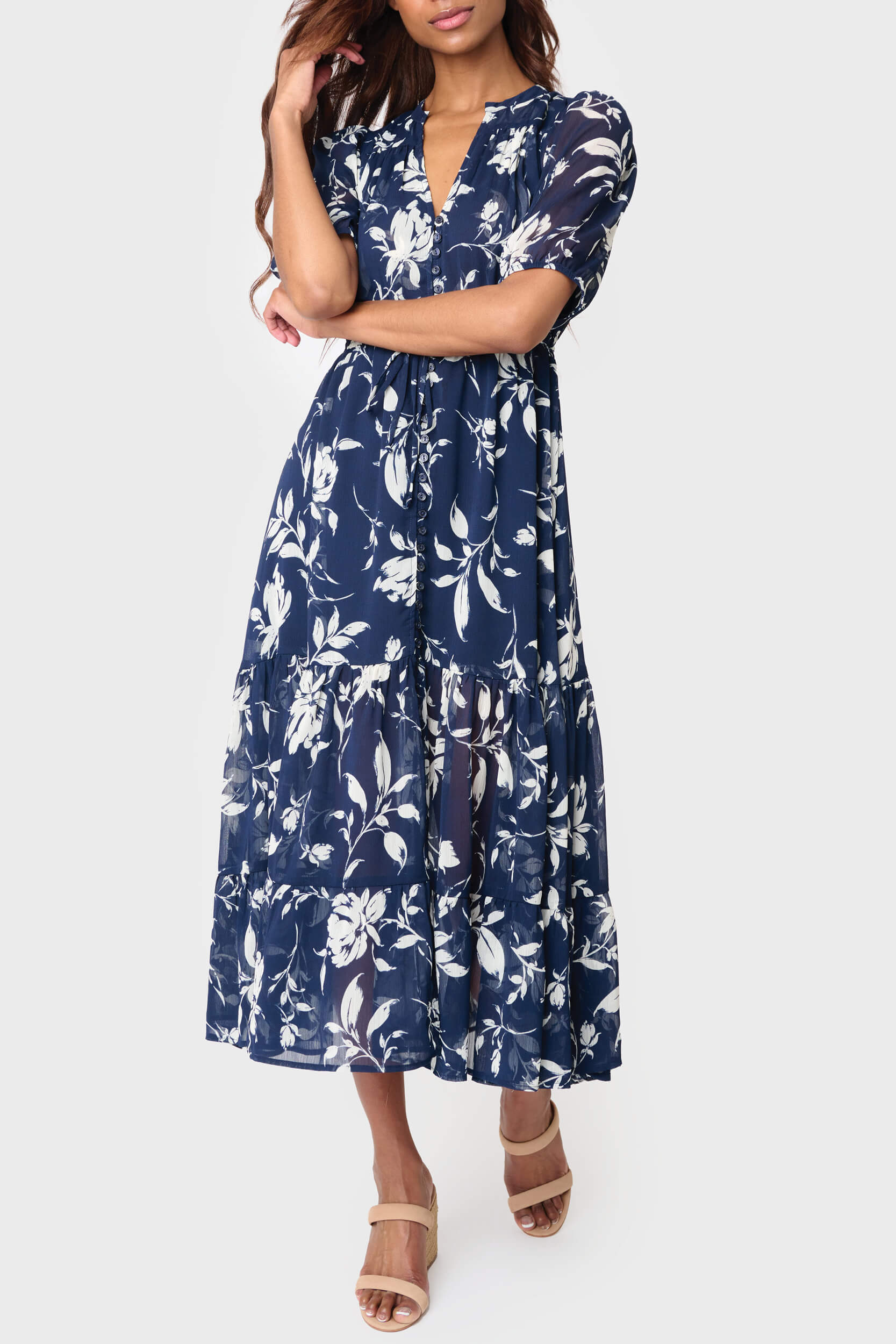 Woman modeling Kira Drawstring Midi Dress in Navy White Floral styled for work and weekends